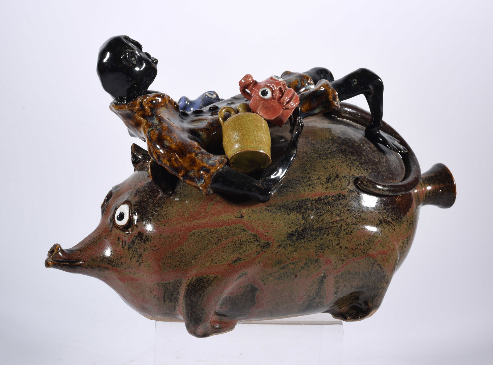 Marvin Bailey Pig Riding Figural: 12 " x 7" black man riding a pig with tiny miniature face jugs. Signed on bottom