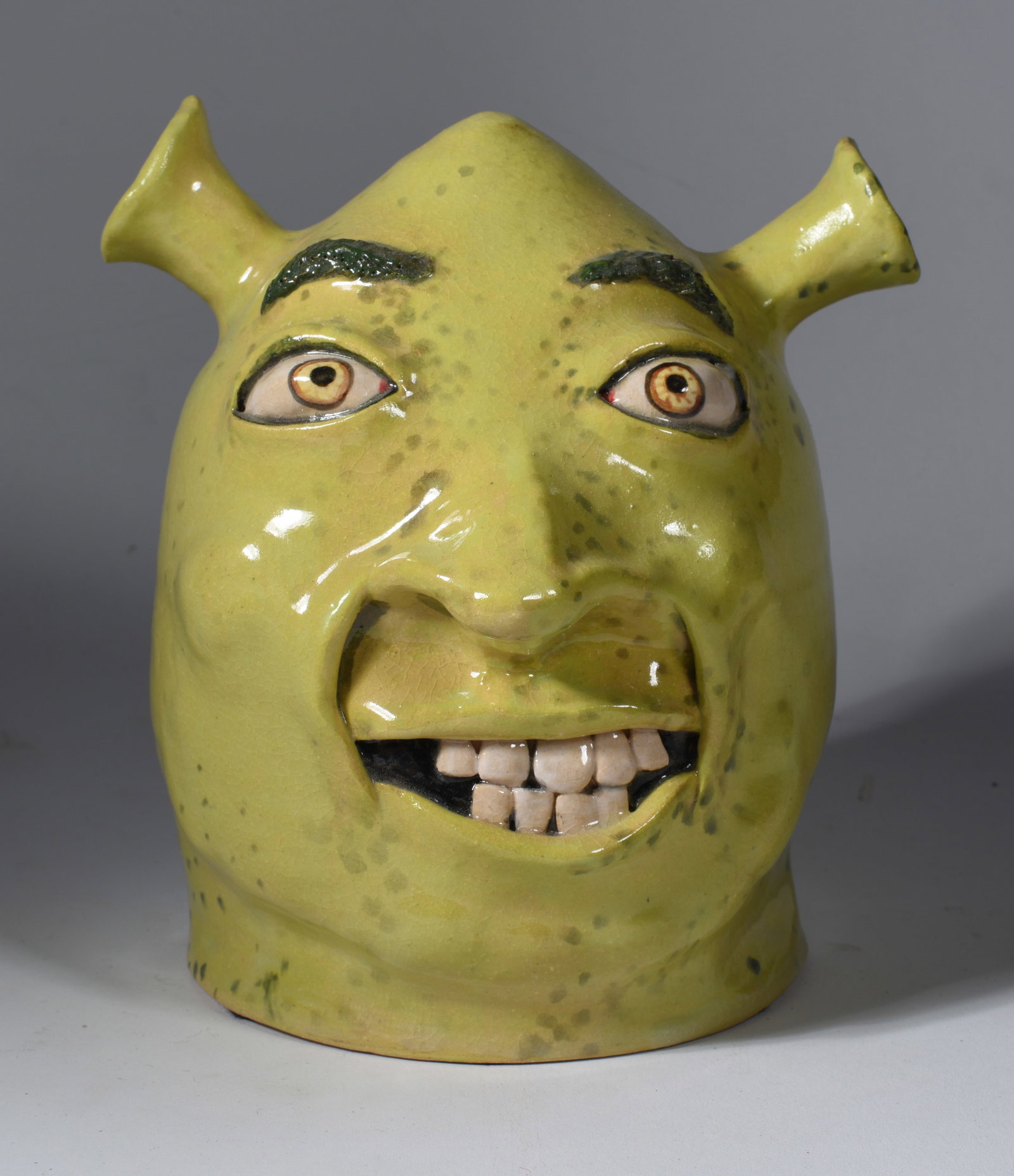 Stacy Lambert Shrek Face Jug: 6.5" an earlier version of the shrek face jug dated 2008.