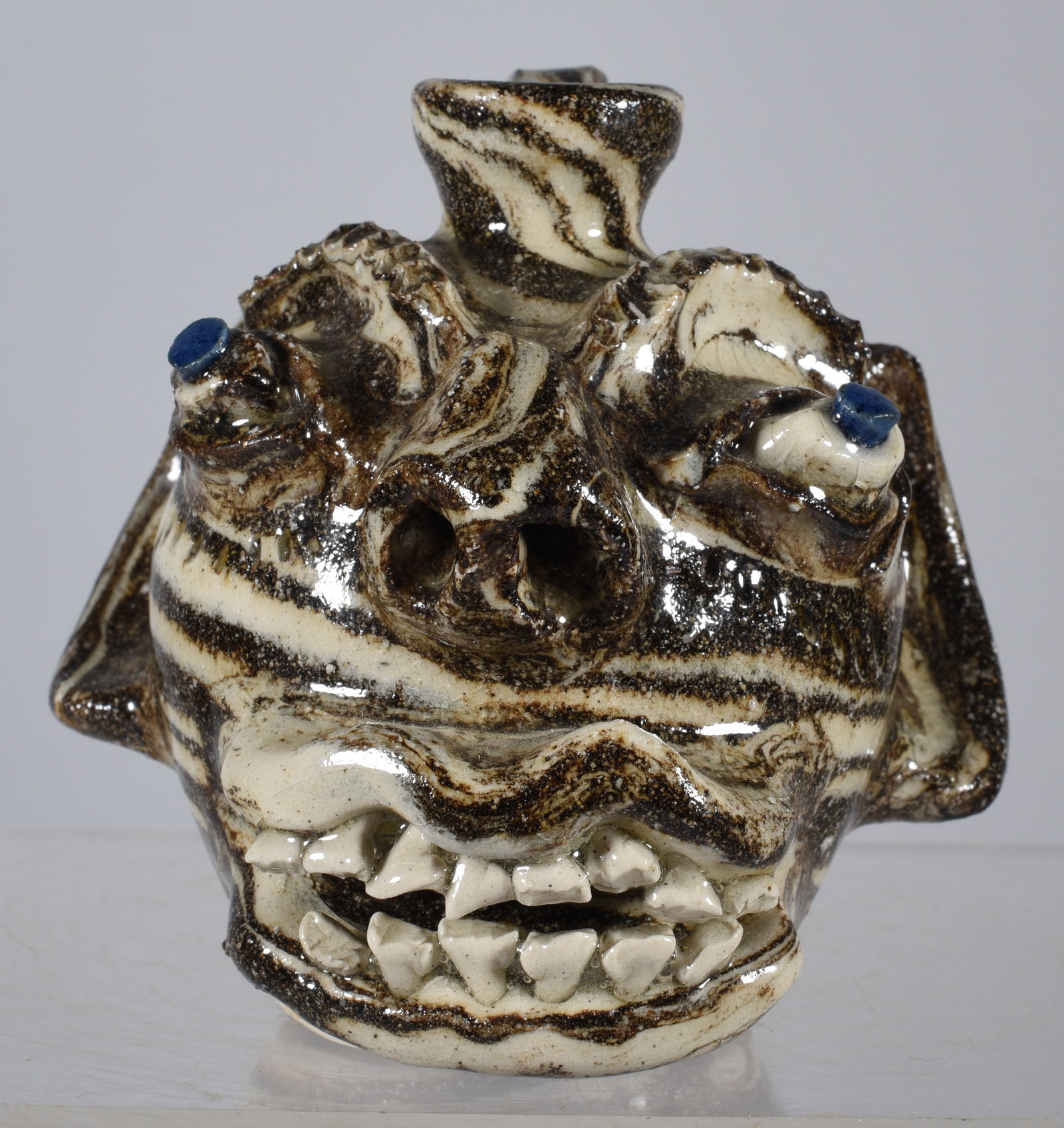 Steve Abee Miniature Swirl Face Jug: 3.75" Steve Abee miniature face jug with a great double row of teeth.