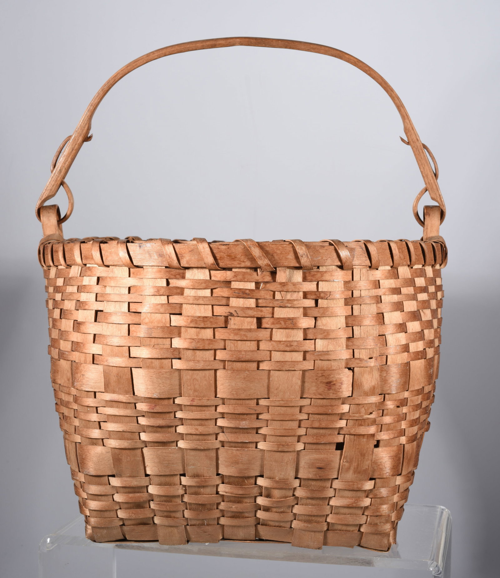 Native American Swing Handle Basket: 12.5" to top of handle, top is 11" x 10.5" nice form, very interesting swing handle construction. Ca. 1940