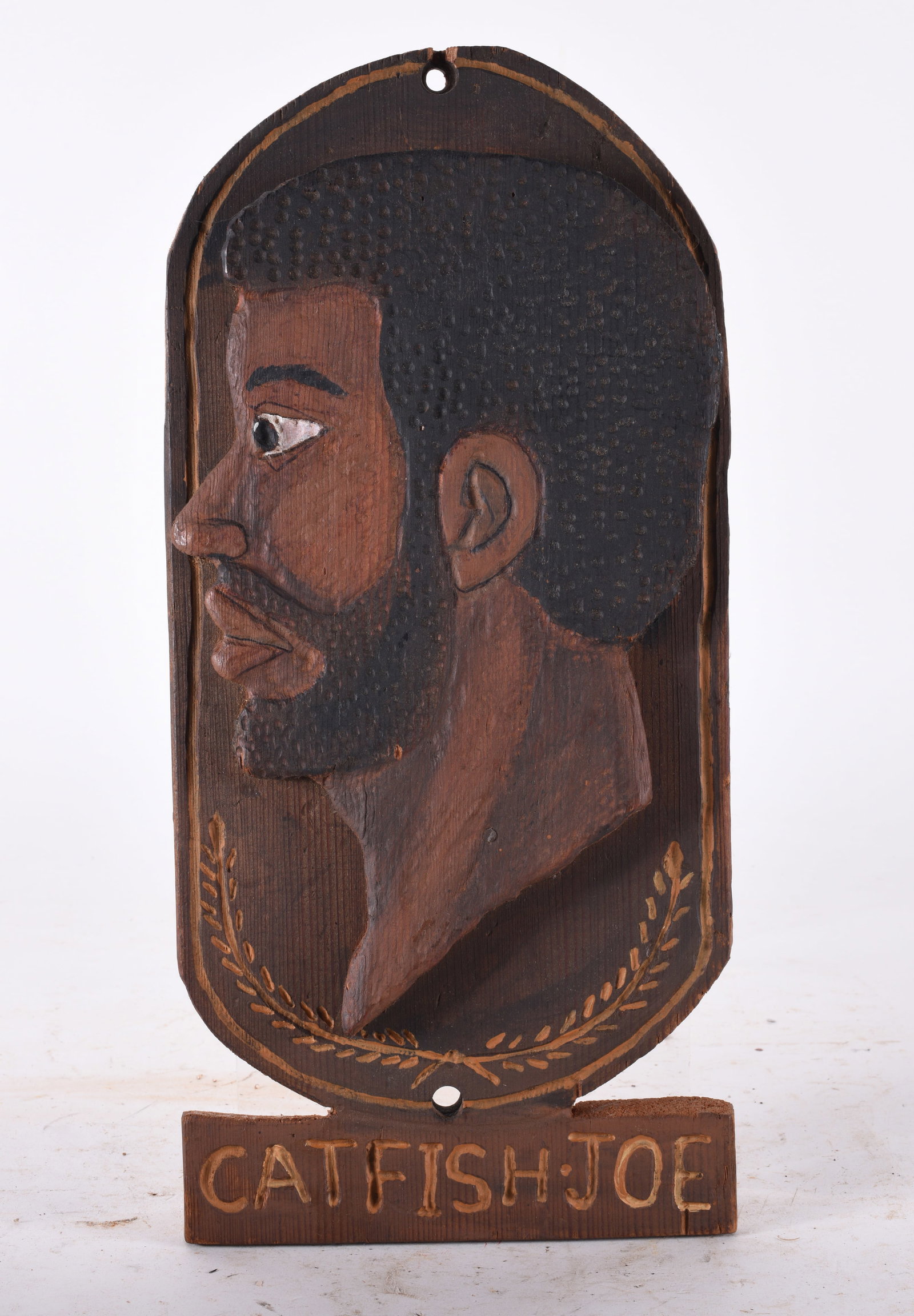 Carved Relief of African American: 7"x 15" titled Catfish Joe. Carved wood and paint.