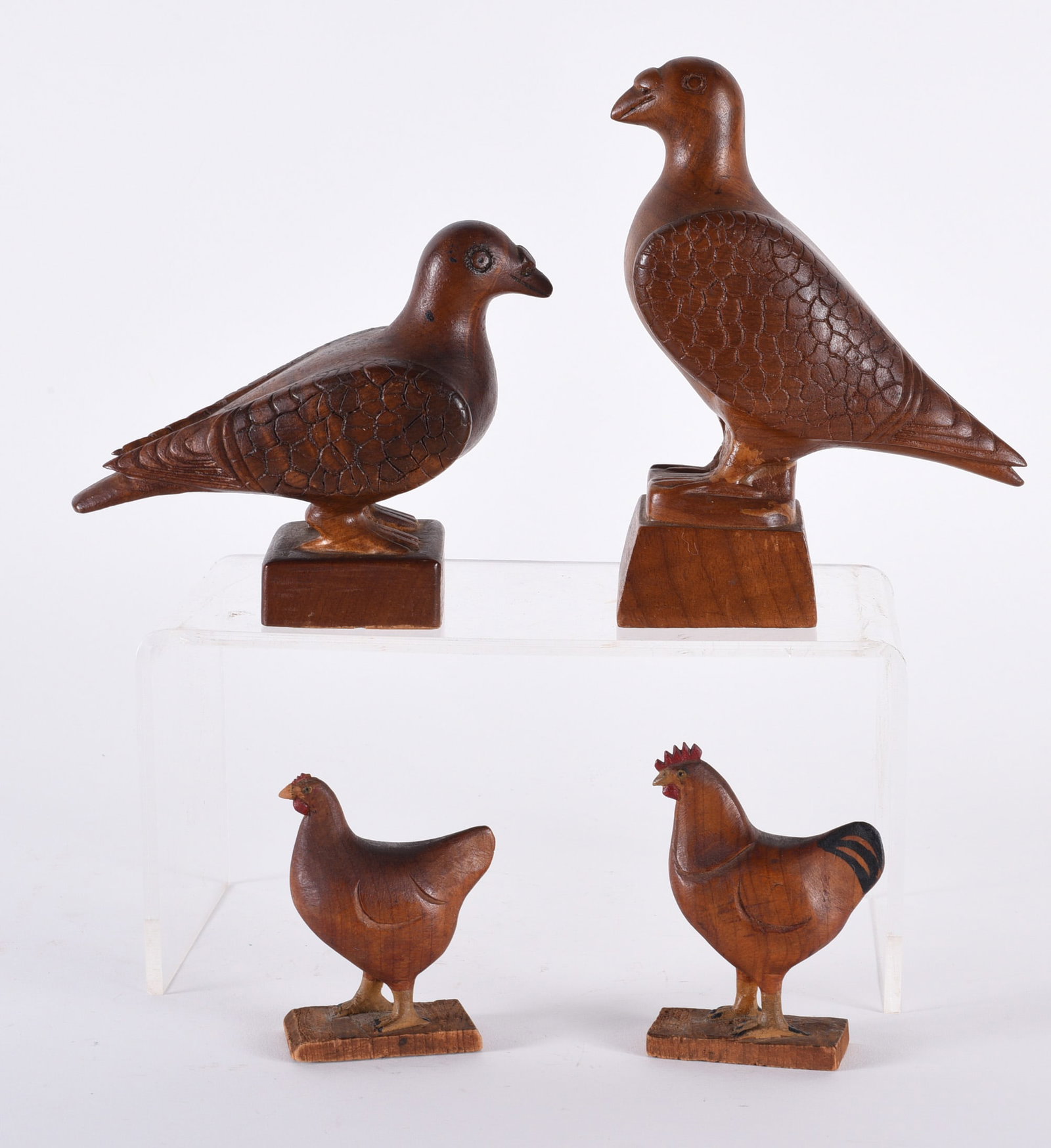 Carved Wooden Birds: Tallest is 6" carved wooden birds, From the Collection of Larry Hackley.