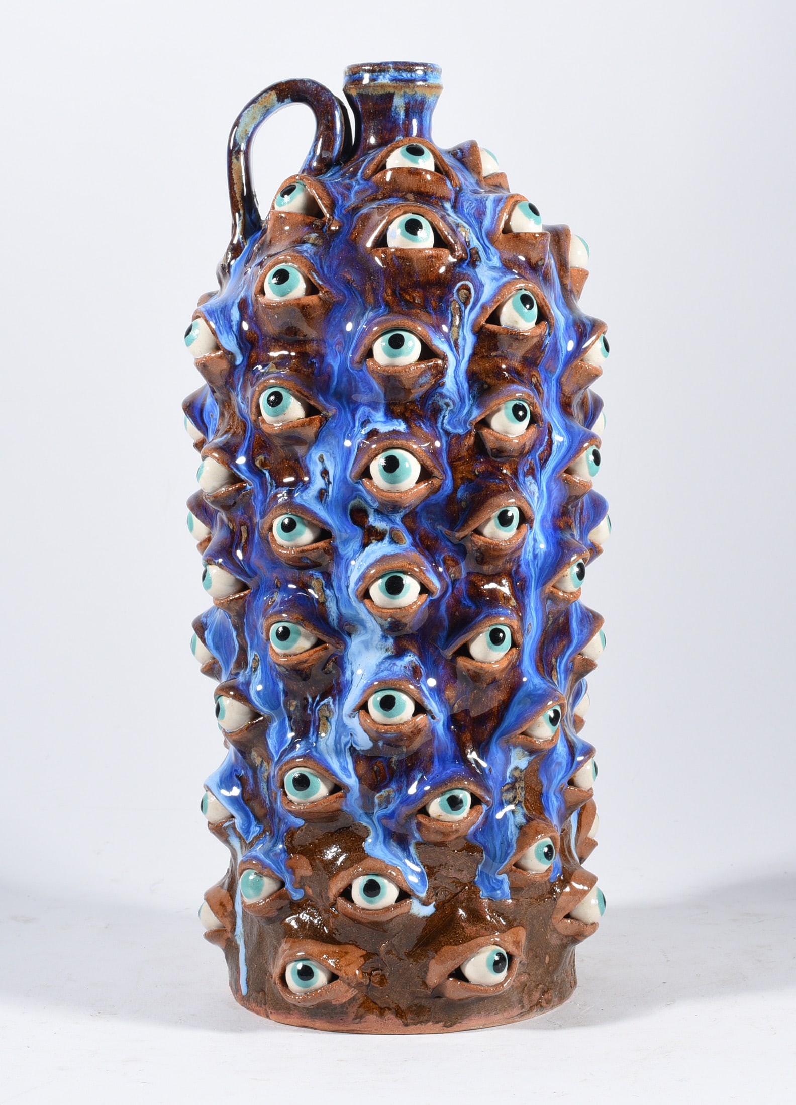 Marvin Bailey Eyeball Jug: 12.5" folk pottery by South Carolina potter Marvin Bailey. The perfect blend of art met with pottery talent. Marvin has been producing folk pottery for over 30 years and is one of the best folk potter