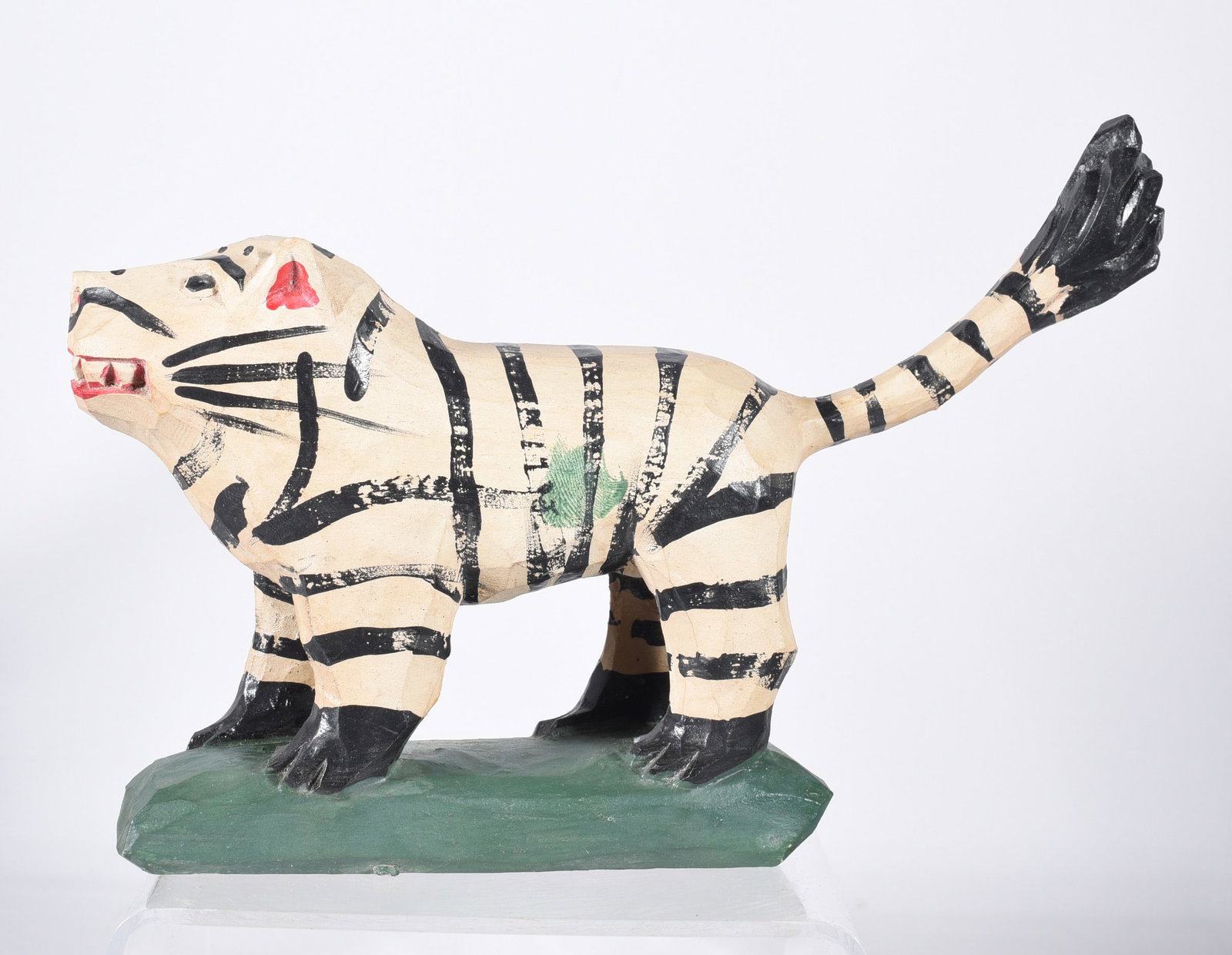 Jonathan Bastian Carved Lion: 8" x 4" carved wood and paint, signed on bottom.
