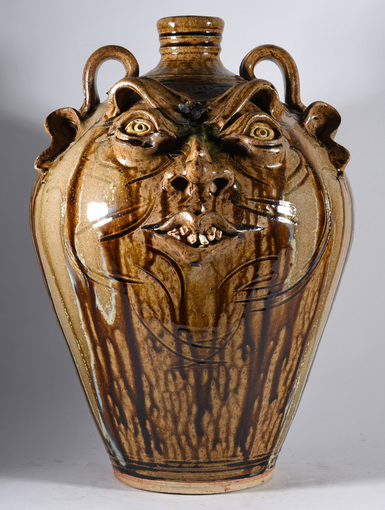 Kim Ellington Face Jug: 18" large Kim Ellington face jug, signed on back GKE. Fantastic alkaline runs with a double row of teeth.