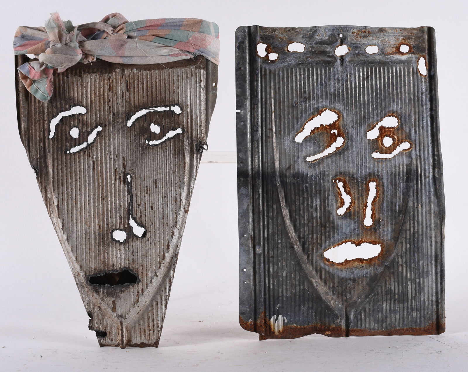 Charlie Lucas "Tinman": 9" x 14" 2 creations by Charlie Lucas. Due Rag Woman and man. Cut tin and other material.