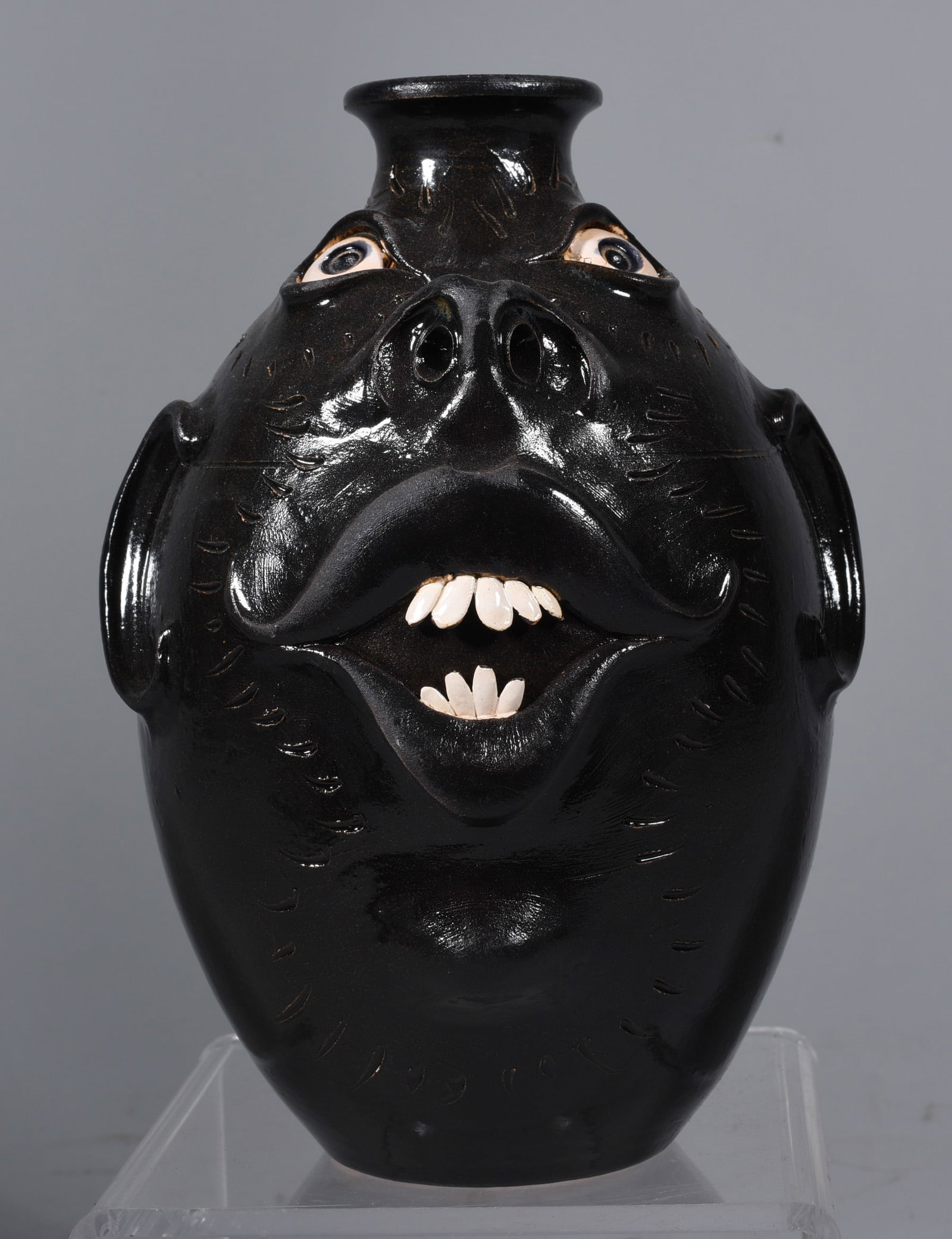 Roger Corn Face Jug: 6.5'' dark glaze with double row of teeth signed on bottom.