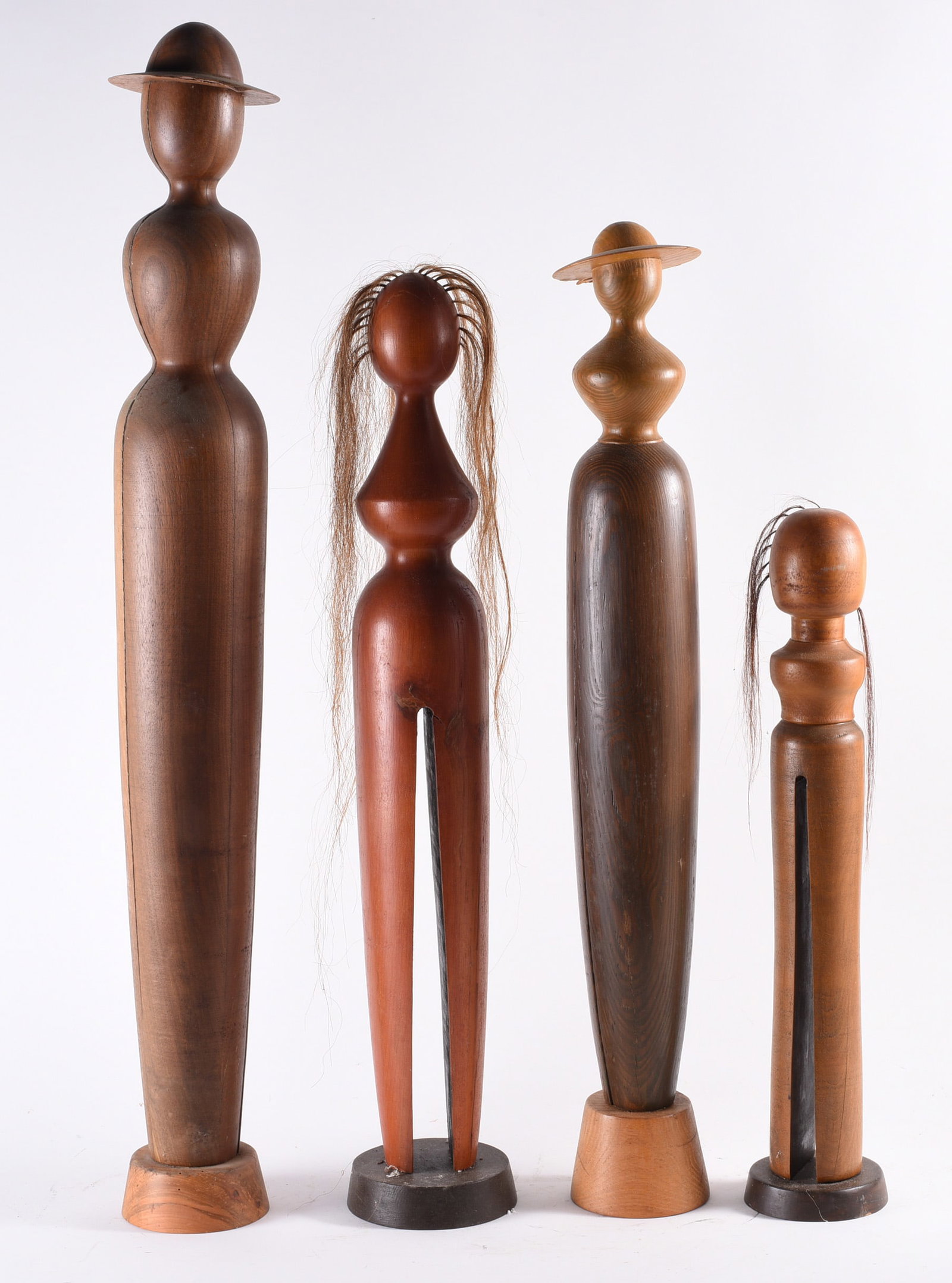 Gene Kangas Wood Carved Sculpture: tallest 39". Carved wood. Gene is a versatile contemporary artist, creating artwork in various media including modern sculptures and installations, digital paintings, folk art, wood turned sculptures,