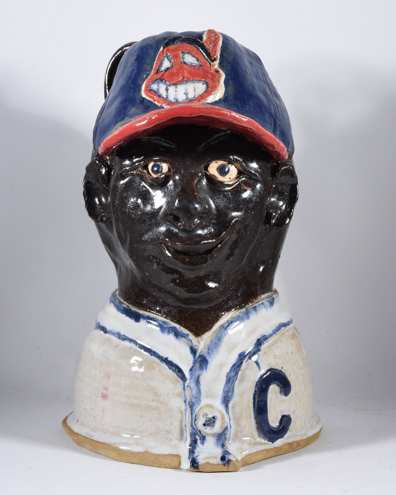Clevland Indians Pottery Baseball Player: 12" pottery bust of a Clevland Indian baseball player. Signed.