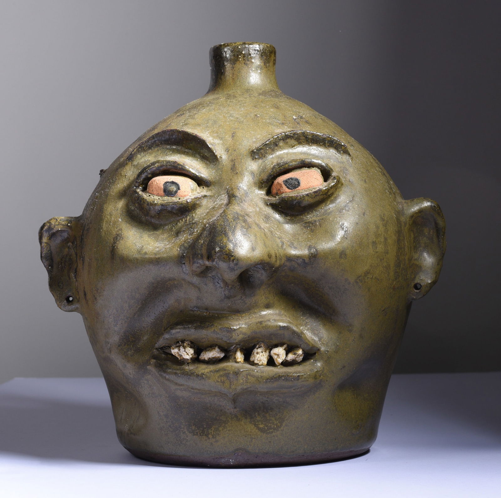 Lanier Meaders Rock Tooth Face Jug: 9" Outstanding Lanier Meaders rock tooth face jug. From the early period ca. 1970. not signed. Purchased directly from the artist. From the Bill Ivey collection.
