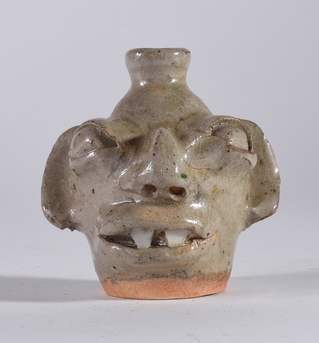 Burlon Craig Miniature Face Jug: 3.5" From the collection of Quincy Scarborough come this rare miniature face jug by Burlon Craig. Ca. 1978. vampire teeth. A rare miniature by Burlon. Miniature face jugs by Burlon are HARD TO FIND!
