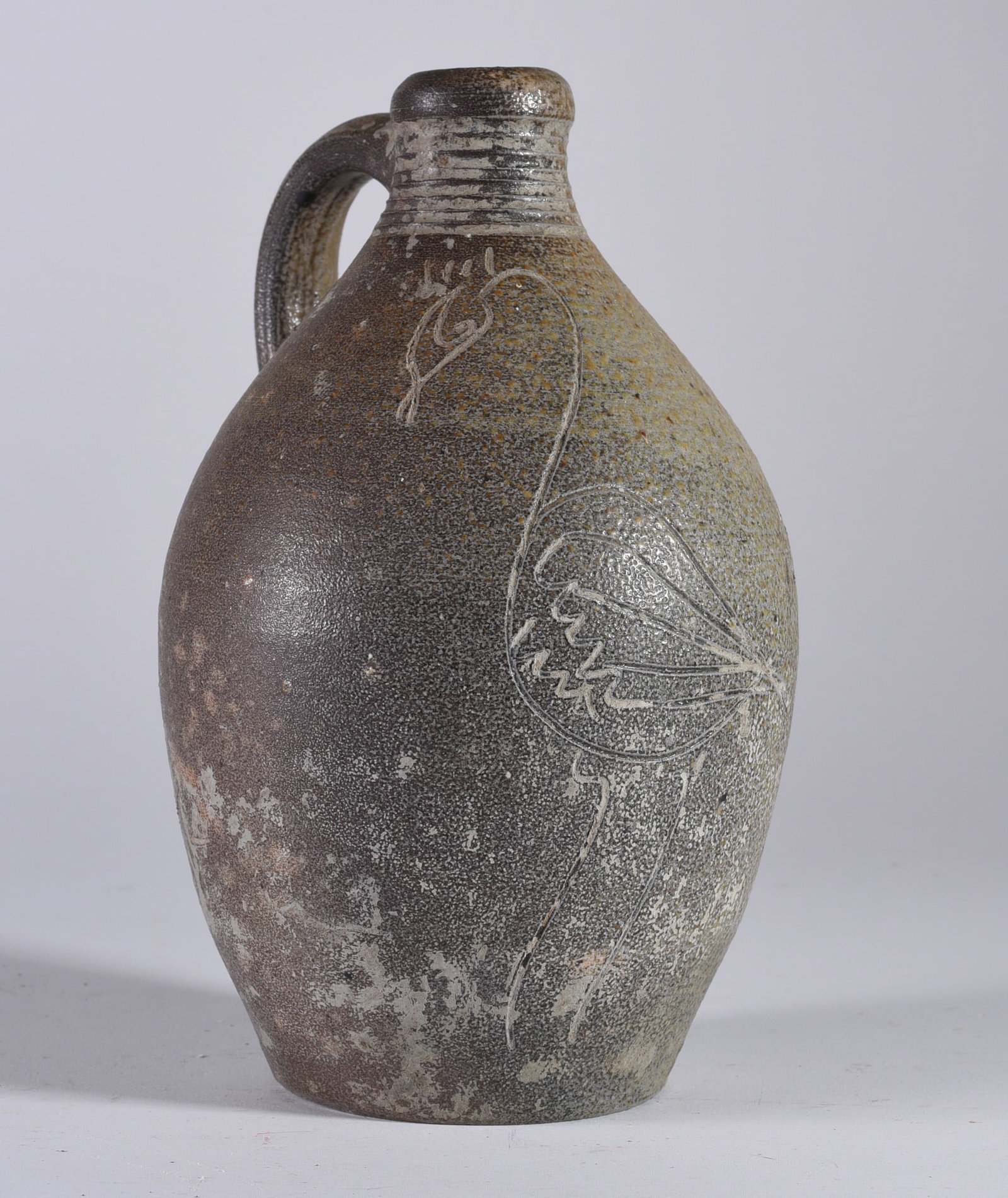 North Carolina Jug with Incised Bird: 7.5" possibly early jug. From the Quincy Scarborough collection. In the form of an early Webster school. Lots of ware. Not signed.