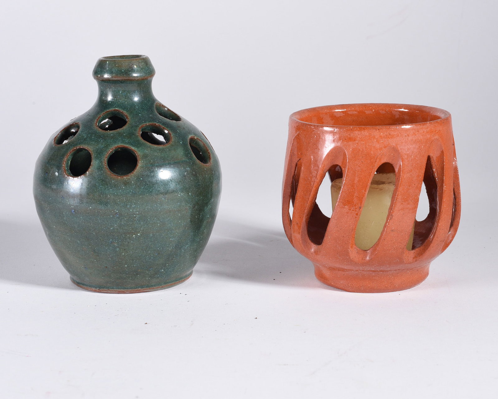 Auman pottery Candle Jugs: 4" two pieces of pottery. Signed on bottom.