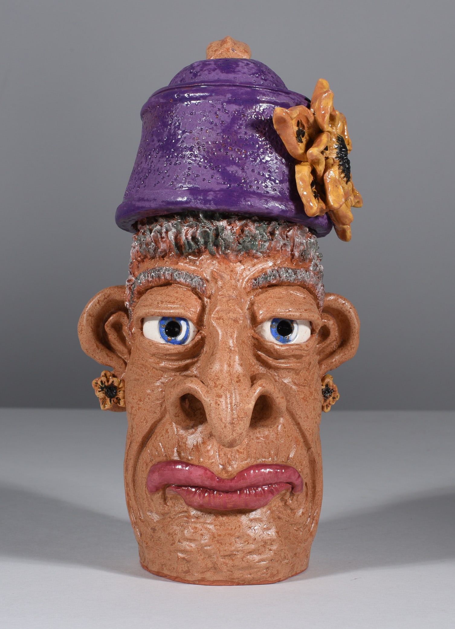 Kay Bevan Folk Pottery Face Jug: 7" outstanding folk pottery art work. This face jug is a piece of art! Signed on bottom. Newly discovered artist by Ledbetter Auctions. A excepetionally talented sculpter and potter.