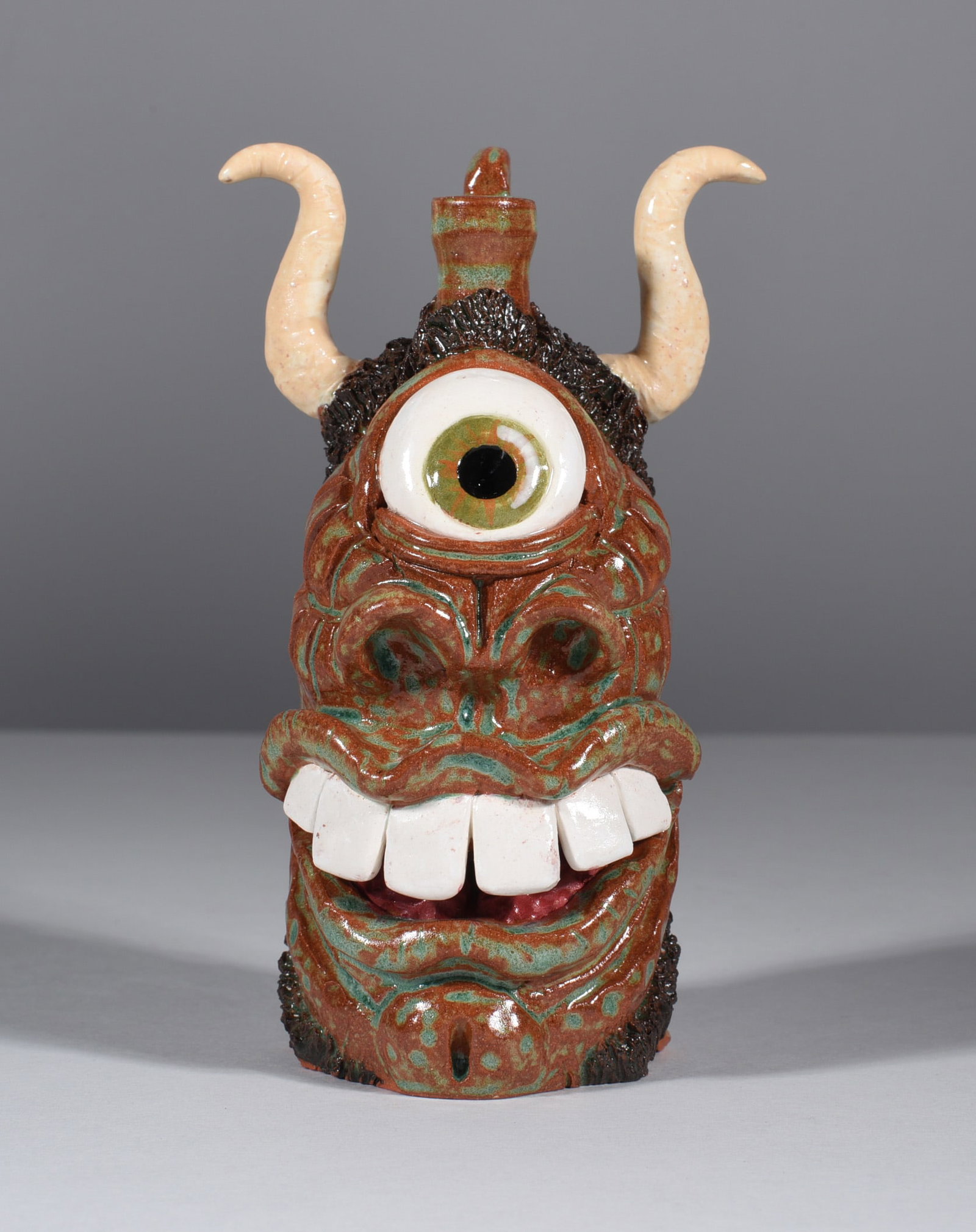 Kay Bevan Folk Pottery Face Jug: 5" outstanding folk pottery art work. This face jug is a piece of art! Signed on bottom. Newly discovered artist by Ledbetter Auctions. A excepetionally talented sculpter and potter.