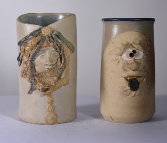 pair of pottery face jug cups
