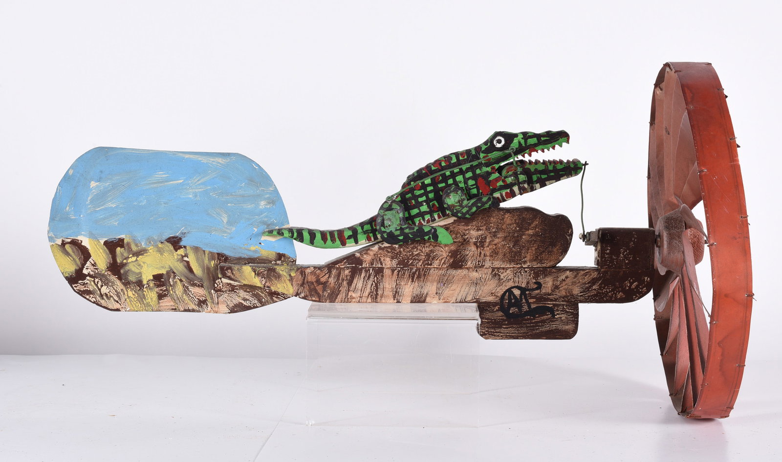 Folk Art Whirligig: 23-1/2" x 12" mechanical whirligig of alligator. Signed.