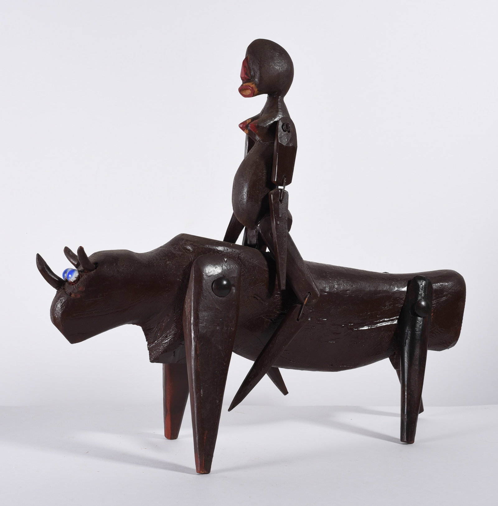 Henry York Folk Art Bull Rider: 20"x17-1/2" folk art sculpture by Henry York, from the collection of Larry Hackley.