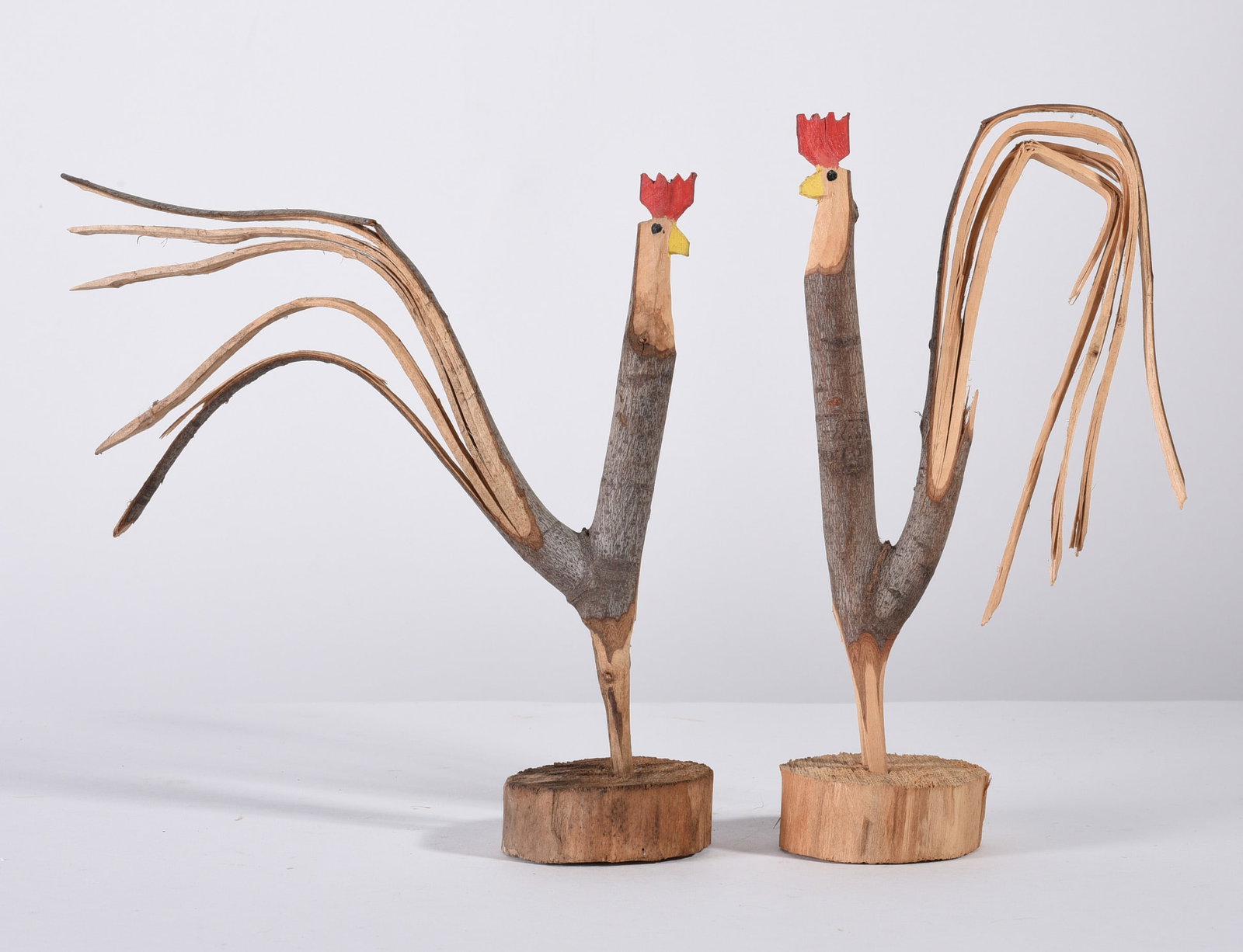 Minnie Adkins Carved Roosters: 9" folk carved roosters, from the collection of Larry Hackley.
