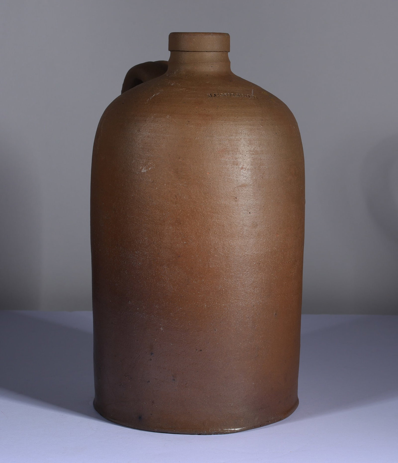 SC Milburn Stamped Jug: 9.5" stamped SC MILBURN for Stephen Calvert Milburn. Very nice size small jug with no issues. A nice stamp at the shoulder.
