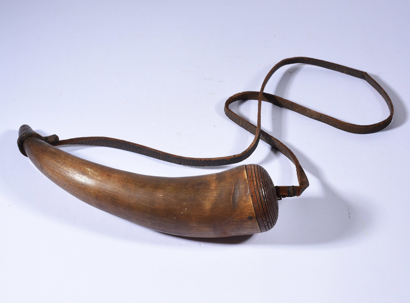 North Carolina Powder Horn ca. 1820: 10" an early North Carolina powder horn with rings carved at the top. From the collection of Bill Ivey.