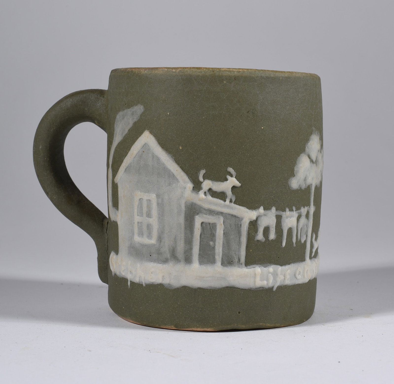 Pisgah Forest Cameo Decorated Mug: 3-1/2" ca. 1950, signed on bottom.