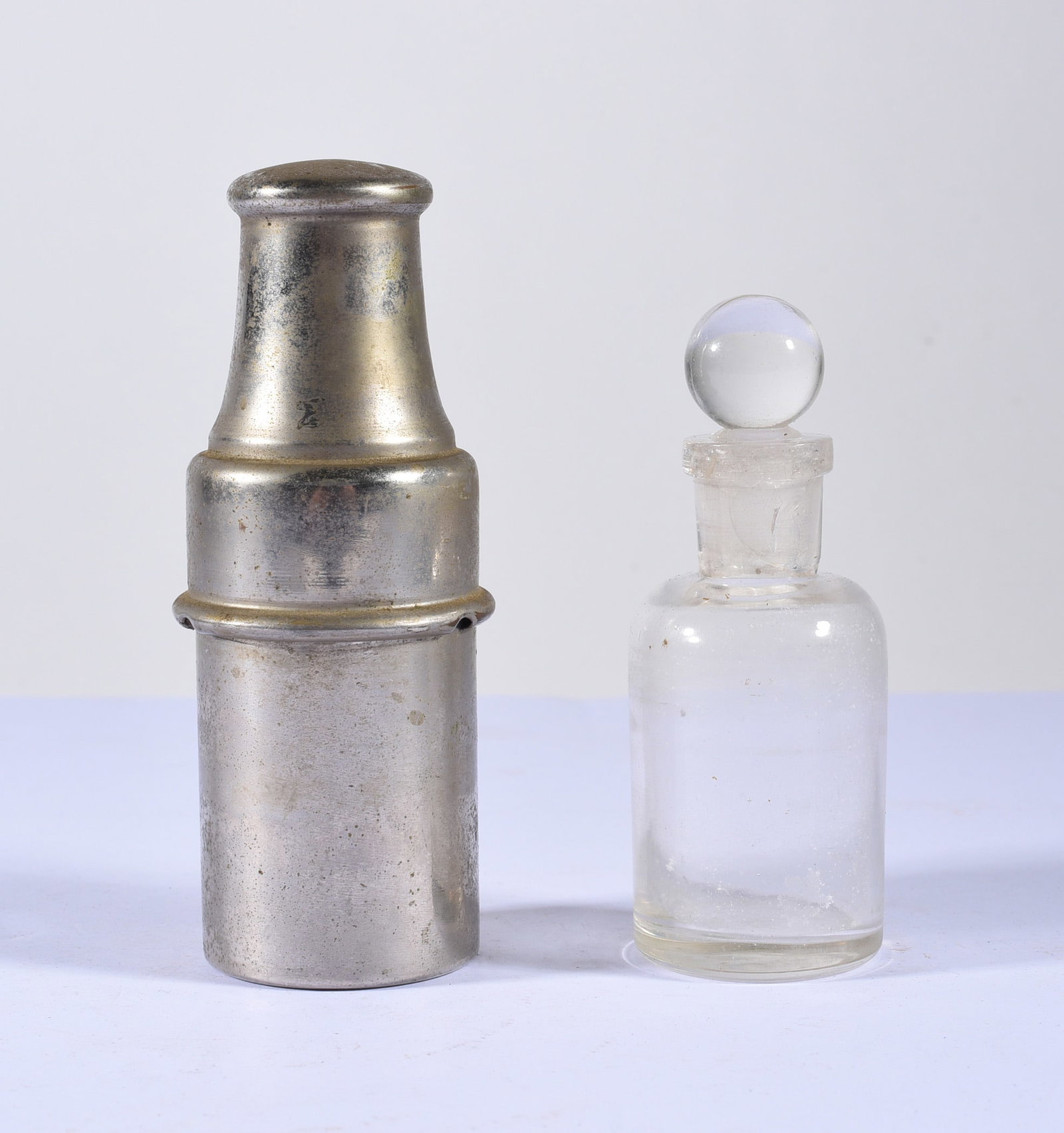 Military Field Use Medicine Bottle with Tin Case: 4" glass medicine bottle with tin case.