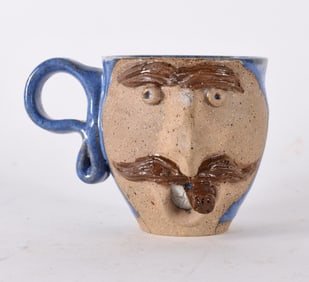 Pottery Face Jug Mug