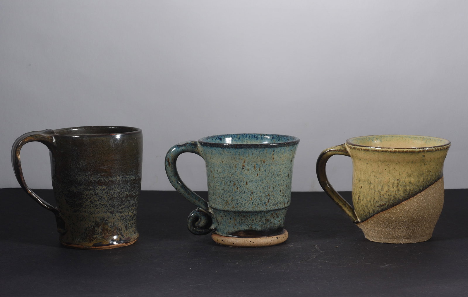North Carolina Pottery Mugs: sizes are found under condition tab and are for shipping purposes. all sizes are approximate for shipping purposes. all items are from a single owner estate collection. Please see photos for details o
