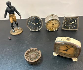 Group of Alarm Clocks and Statue