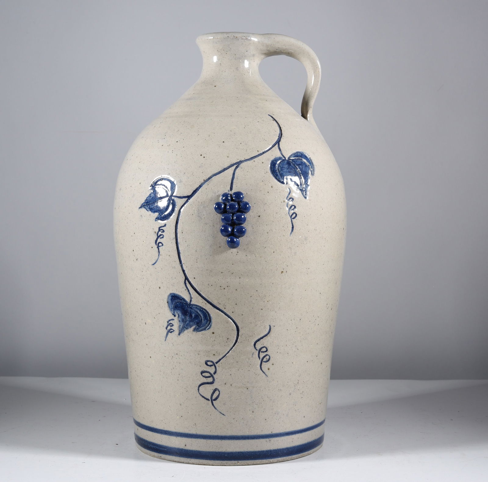 PA Stoneware Jug signed Keeton: stoneware jug with blue bands. Signed on bottom dated 1995. condition is excellent.