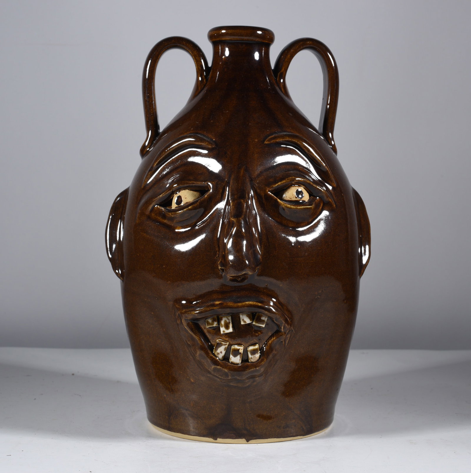 Conner Prairie Face Jug: face jug by Conner Prairie. Signed on bottom. Dated 2000