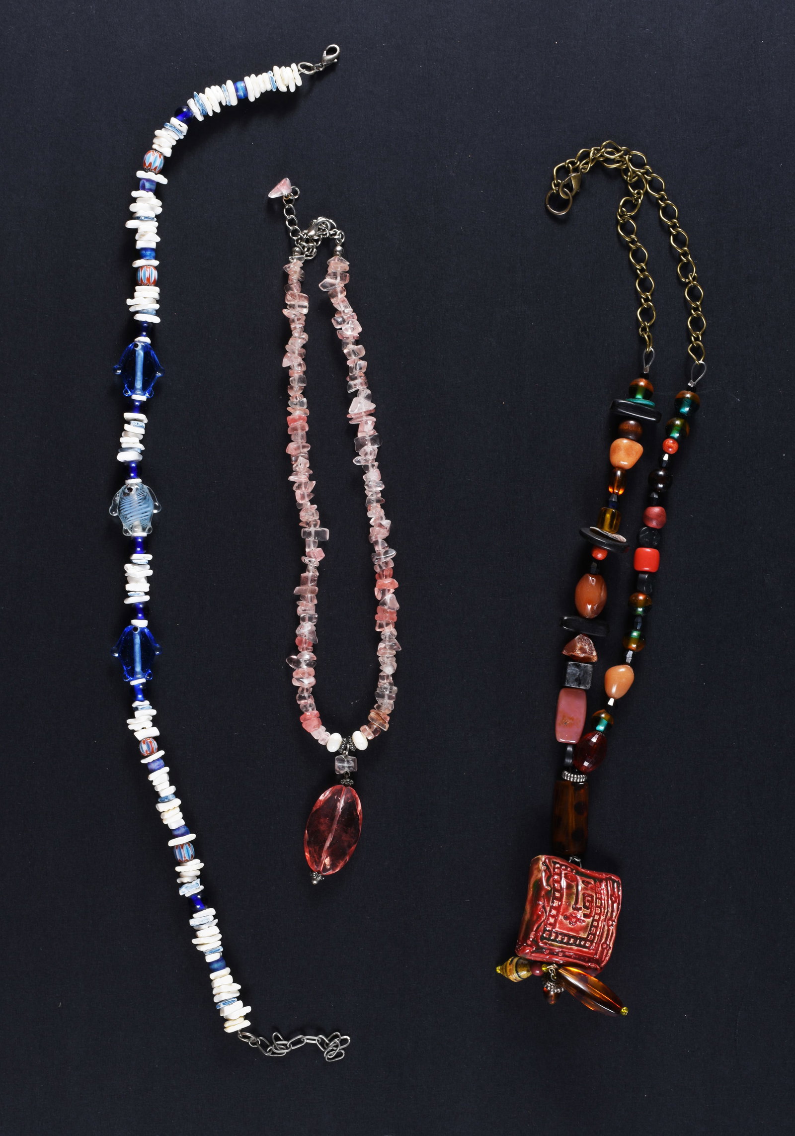 Tribal Beads and Stones Necklace Group: This is a collection of jewelry from two estates. All items are sold as is where is. We can in house ship and our price is below under condition. The price to the right is 3rd party shipping. To get i