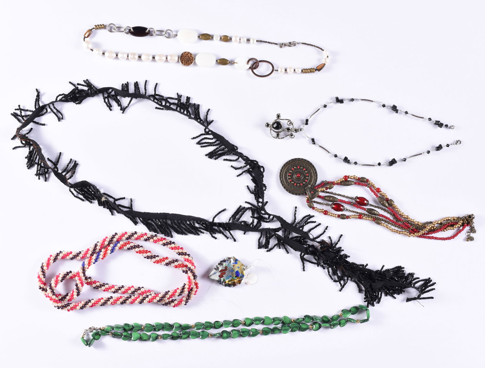 Tribal Trade Beaded Necklace Group: This is a collection of jewelry from two estates. All items are sold as is where is. We can in house ship and our price is below under condition. The price to the right is 3rd party shipping. To get i