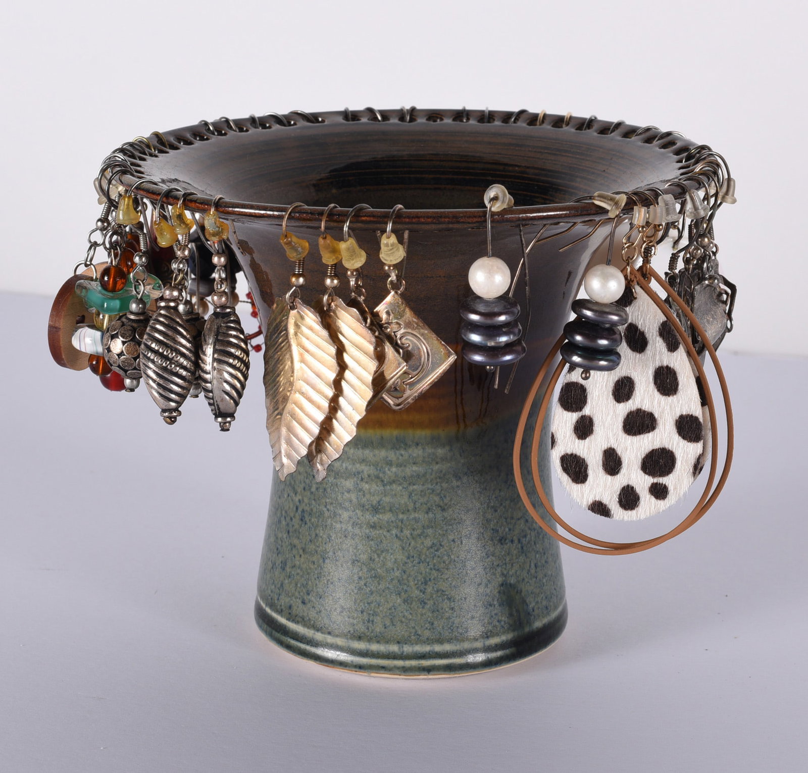 Vintage Earing Collection on Pottery Earing Stand: This is a collection of jewelry from two estates. All items are sold as is where is. We can in house ship and our price is below under condition. The price to the right is 3rd party shipping. To get i