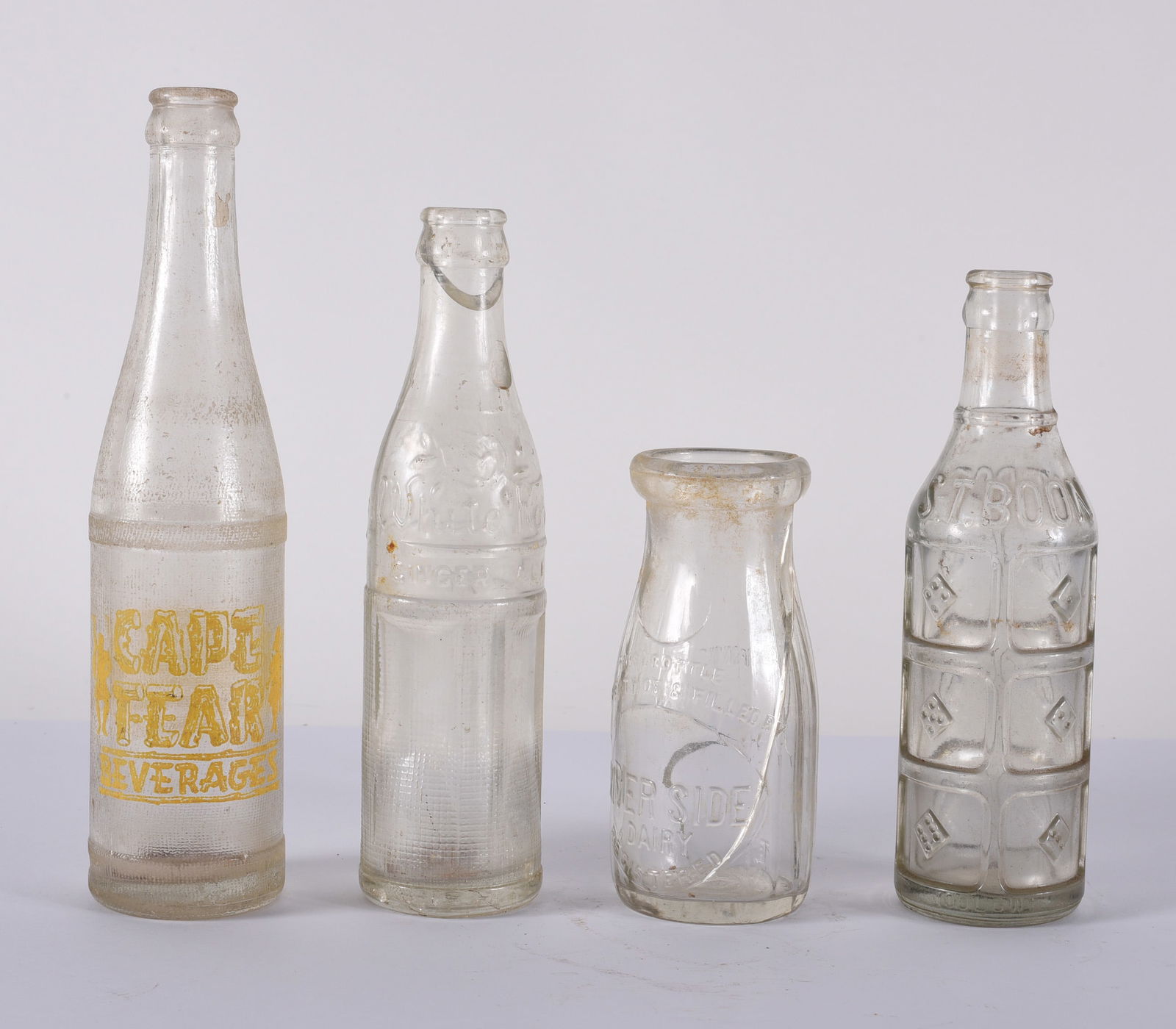 Four Vintage Soda and Milk Bottles (damage on some) (1 of 2)