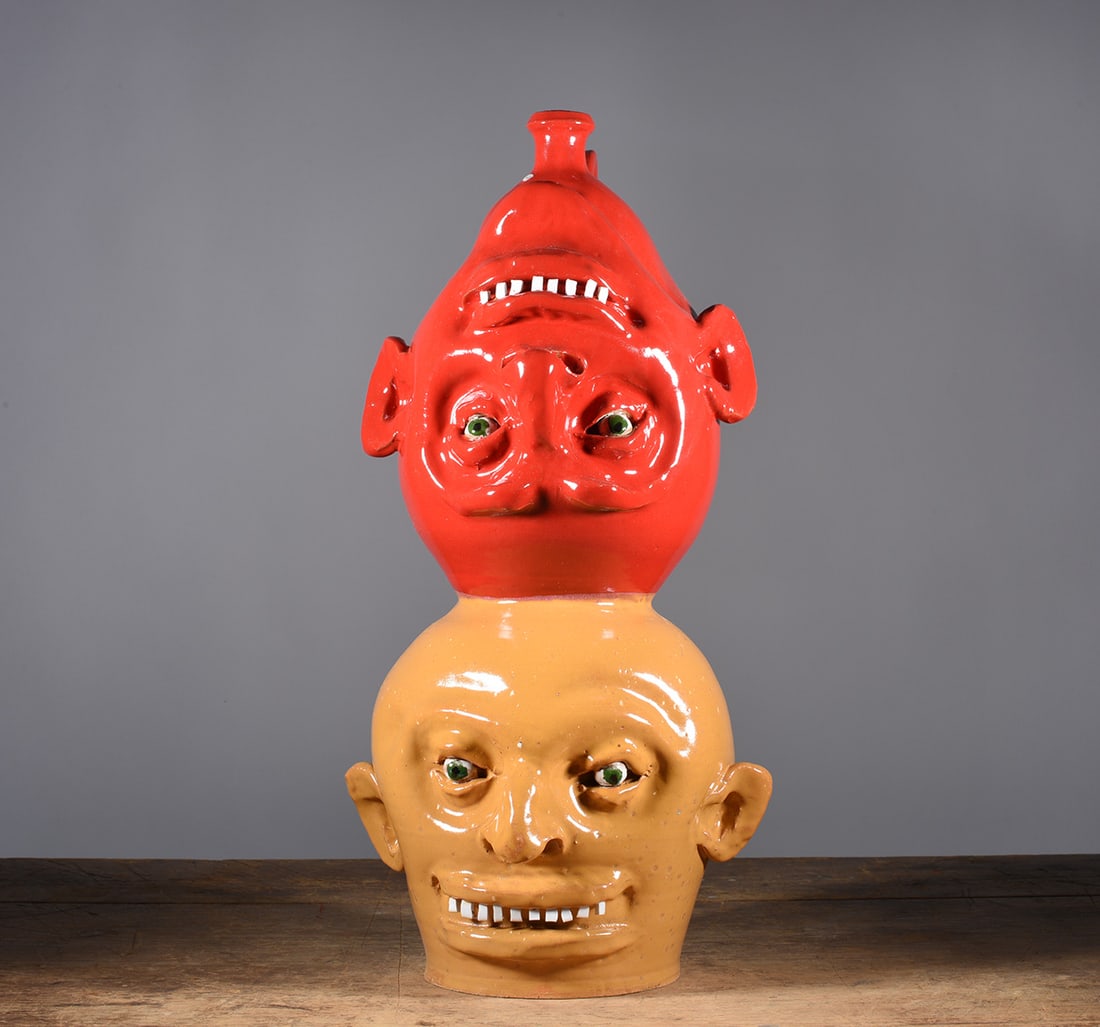 Marvin Bailey Double Stack Face Jug: outstanding piece of Marvin Bailey with the double stack totem face jug. Red Glaze on top. Both faces with broken china teeth and clay eyes. Signed.