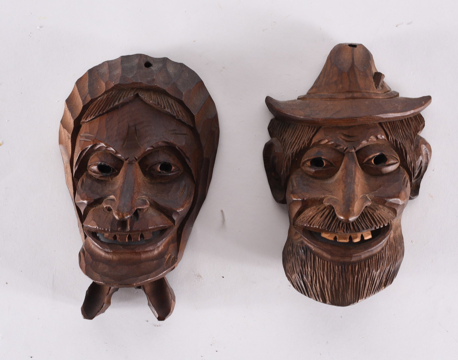 Folk Carved Wall Masks: these items are from the estate collection of Mary Wells. All items are sold as is where is see photos.