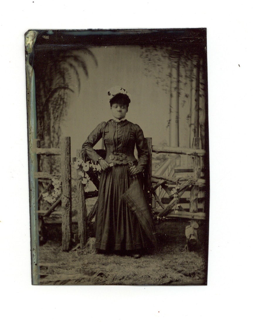 Tintype Photograph of African American Woman in Fine Dress: 1/6th plate tintype of an African American woman in fine dress with umbrella. Nice image.