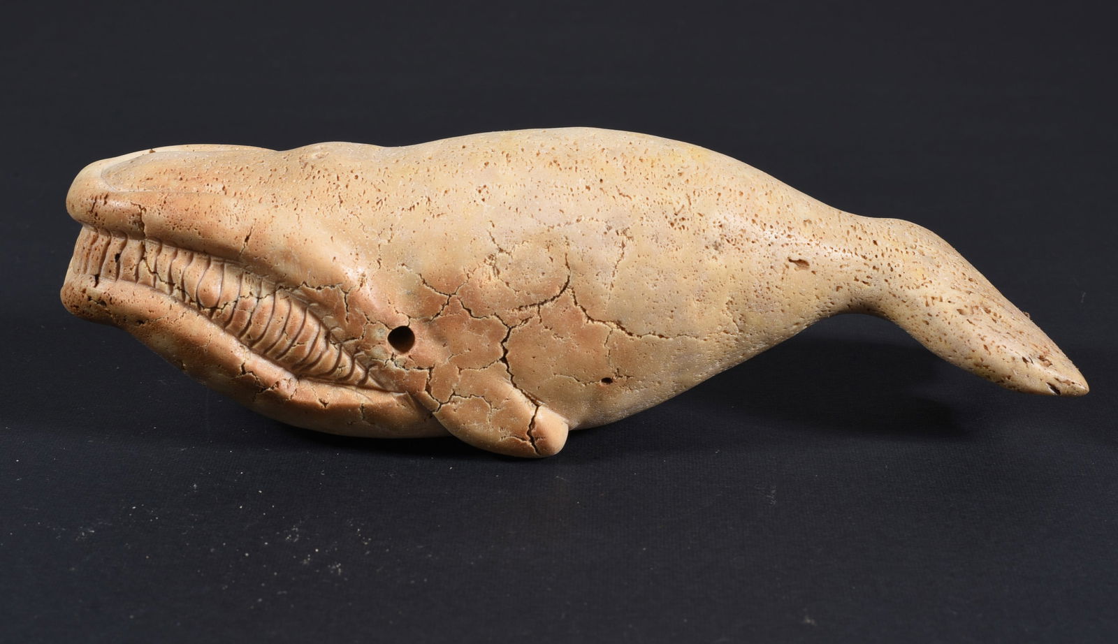 Inuit Carved Whale Bone Whale: These bone carvings were found in an attic trunk wrapped in 1960s newspaper. The collection came straight from the attic to our gallery and we unwrapped and photoed. All of these are small under 7". W