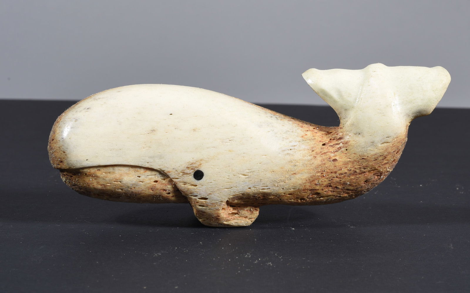 Inuit Carved Whale Bone Whale: These bone carvings were found in an attic trunk wrapped in 1960s newspaper. The collection came straight from the attic to our gallery and we unwrapped and photoed. All of these are small under 7". W