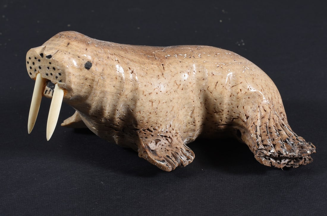 Inuit Carved Whale Bone Walrus: These bone carvings were found in an attic trunk wrapped in 1960s newspaper. The collection came straight from the attic to our gallery and we unwrapped and photoed. All of these are small under 7". W
