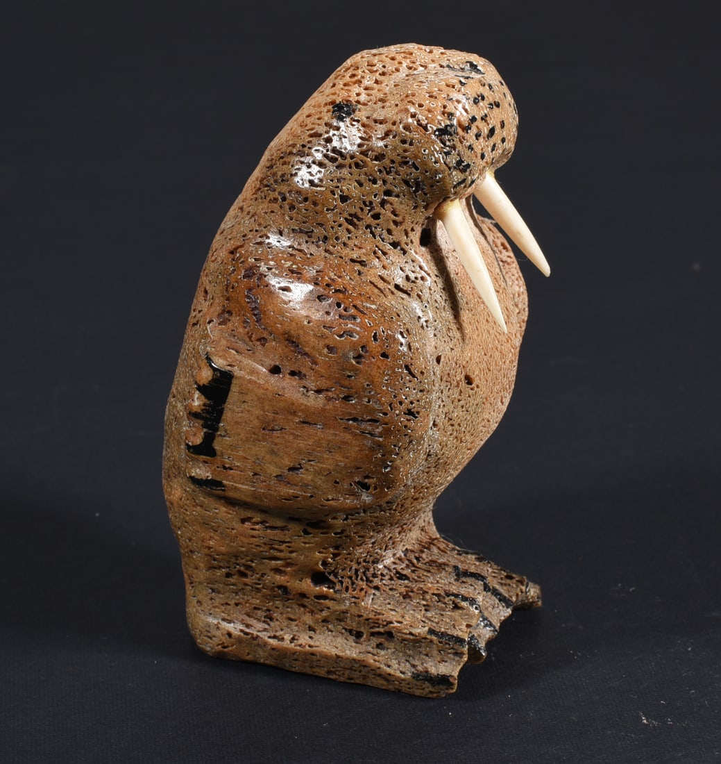 Inuit Carved Whale Bone Walrus: These bone carvings were found in an attic trunk wrapped in 1960s newspaper. The collection came straight from the attic to our gallery and we unwrapped and photoed. All of these are small under 7". W