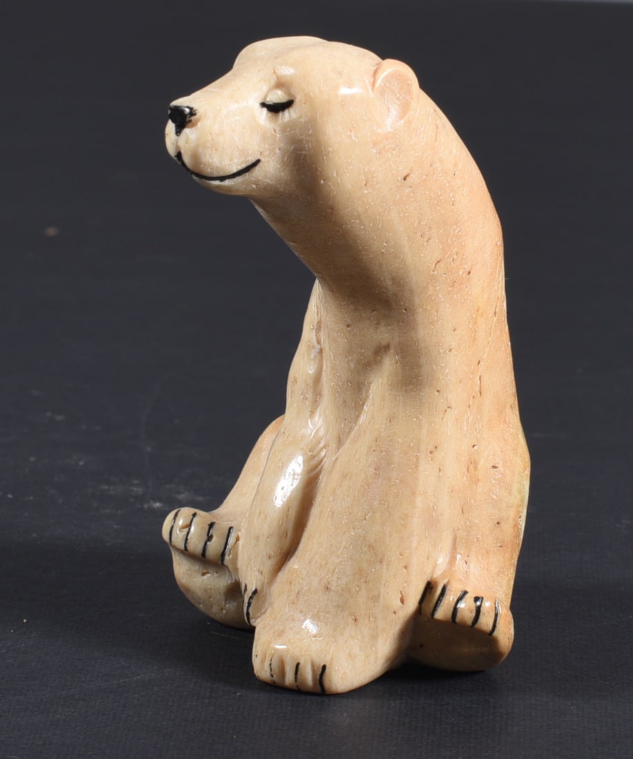 Inuit Carved Whale Bone Seated Bear: These bone carvings were found in an attic trunk wrapped in 1960s newspaper. The collection came straight from the attic to our gallery and we unwrapped and photoed. All of these are small under 7". W