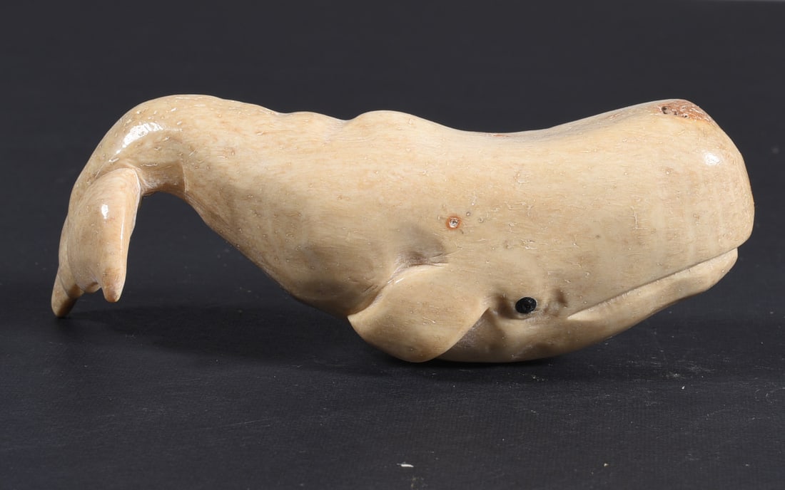 Inuit Carved Whale Bone Figure: These bone carvings were found in an attic trunk wrapped in 1960s newspaper. The collection came straight from the attic to our gallery and we unwrapped and photoed. All of these are small under 7". W