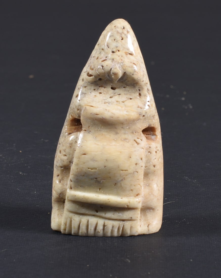 Inuit Carved Whale Bone Figure: These bone carvings were found in an attic trunk wrapped in 1960s newspaper. The collection came straight from the attic to our gallery and we unwrapped and photoed. All of these are small under 7". W