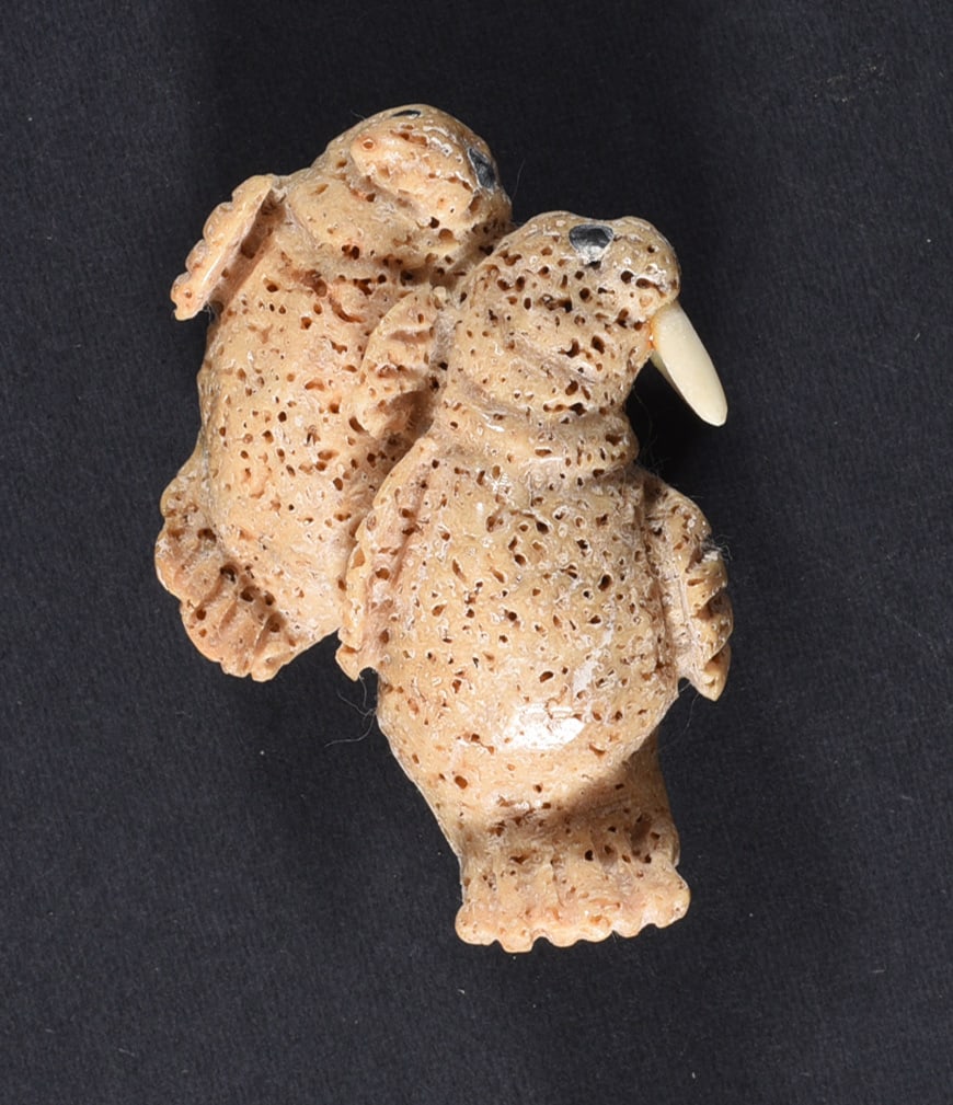 Inuit Carved Whale Bone Figure: These bone carvings were found in an attic trunk wrapped in 1960s newspaper. The collection came straight from the attic to our gallery and we unwrapped and photoed. All of these are small under 7". W