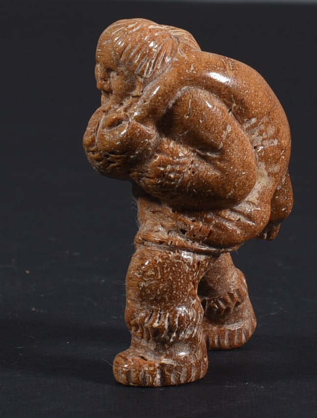 Inuit Carved Whale Bone Figure: These bone carvings were found in an attic trunk wrapped in 1960s newspaper. The collection came straight from the attic to our gallery and we unwrapped and photoed. All of these are small under 7". W