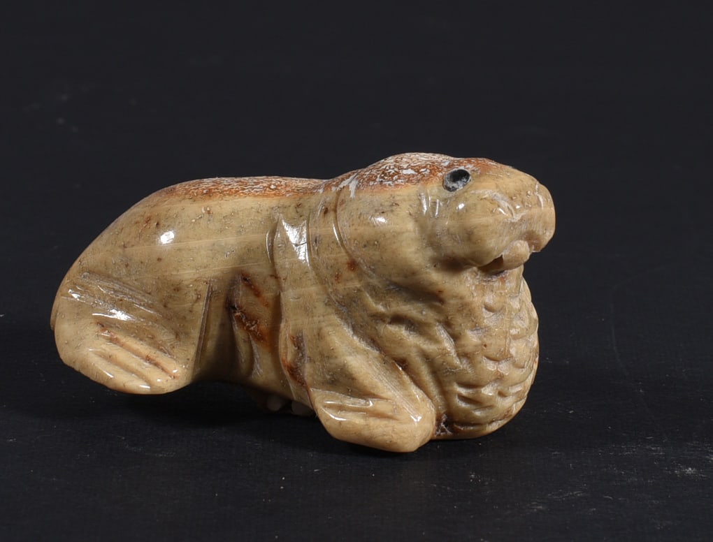 Inuit Carved Whale Bone Figure: These bone carvings were found in an attic trunk wrapped in 1960s newspaper. The collection came straight from the attic to our gallery and we unwrapped and photoed. All of these are small under 7". W