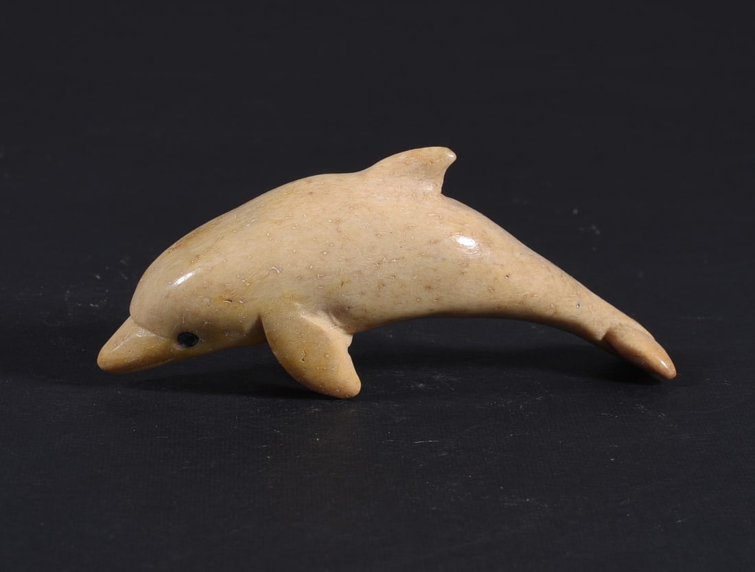 Inuit Carved Whale Bone Figure: These bone carvings were found in an attic trunk wrapped in 1960s newspaper. The collection came straight from the attic to our gallery and we unwrapped and photoed. All of these are small under 7". W